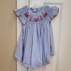 Pleats and stitches Crab/anchor bishop dress